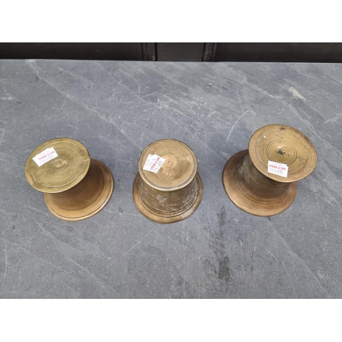 1425 - Three 18th/19th century brass mortars, 9.4cm high. (3)