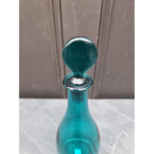 1432 - A Georgian green glass decanter and stopper, 30cm high.