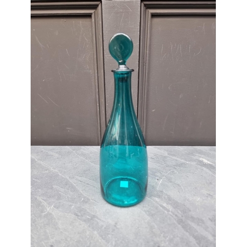 1432 - A Georgian green glass decanter and stopper, 30cm high.