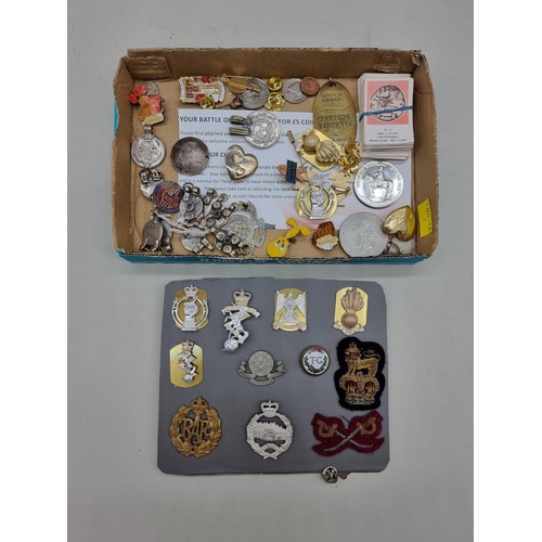 1453 - A collection of badges and coins, to include military examples.