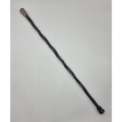 1527 - A Thai or Eastern ebonized and silver mounted cane. 