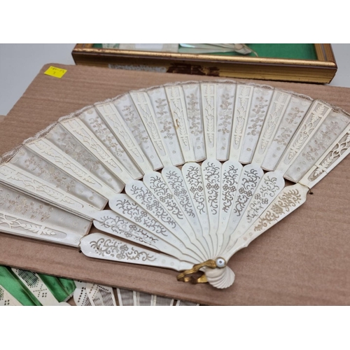 1531 - Four old fans, to include three bone examples, one framed and glazed.