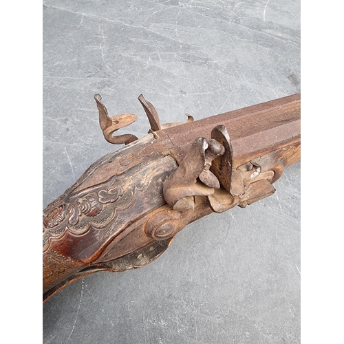 1539 - A circa 1800 muzzle loading double barrel flintlock shotgun, having carved walnut stock and 60cm bar... 