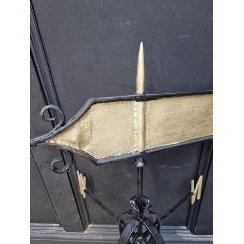 1557 - A black and gilt wrought iron weathervane, total height 103.5cm. 