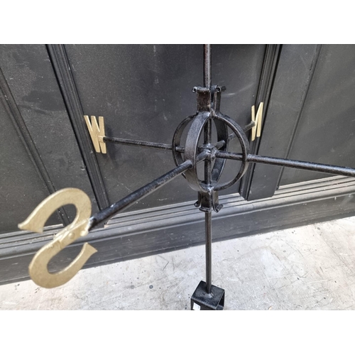 1557 - A black and gilt wrought iron weathervane, total height 103.5cm. 