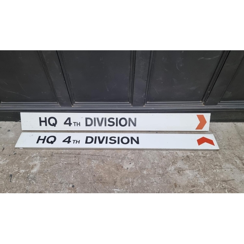 1560 - A pair of 'HQ 4th Division' metal signs, 158cm wide. (2)