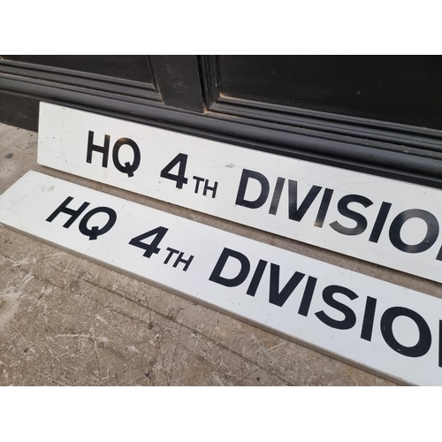 1560 - A pair of 'HQ 4th Division' metal signs, 158cm wide. (2)