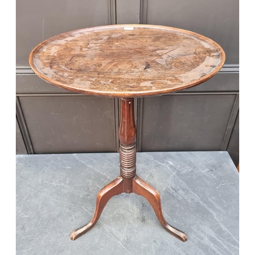 1067 - An early 19th century mahogany circular tilt top tripod table, with dished top, 51cm diameter.&... 