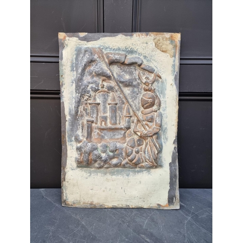 1200A - A lead relief plaque of a medieval knight and castle, 59.5 x 41cm. 