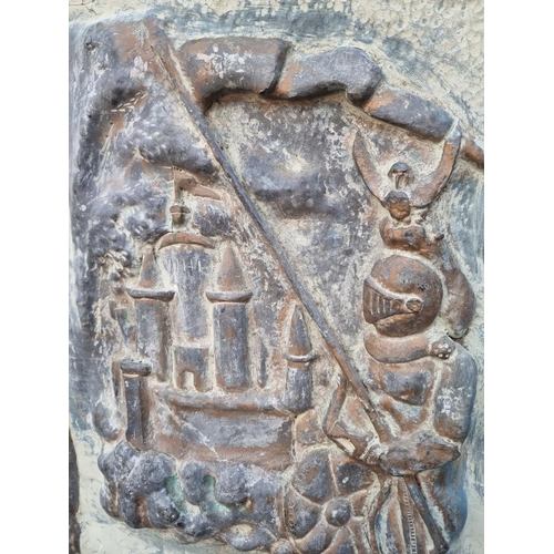 1200A - A lead relief plaque of a medieval knight and castle, 59.5 x 41cm. 