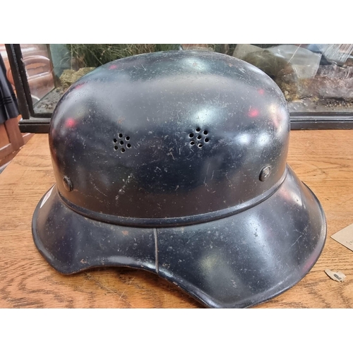 1541 - A German Third Reich Luftshutz Model 38 'Gladiator' helmet, black painted, marked RL238/3.... 