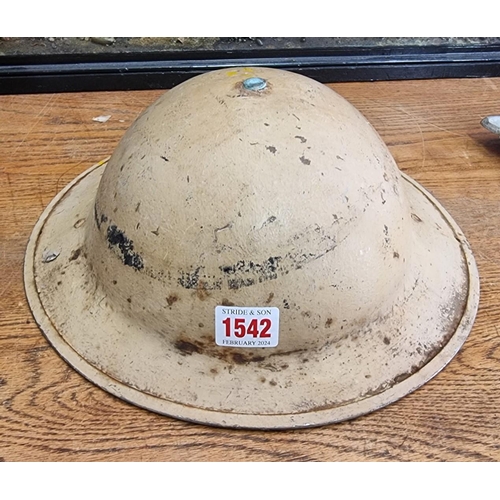 1542 - A British WWII 8th Army 'Desert Rats' steel helmet, stamped 'Jaeger Rand'.