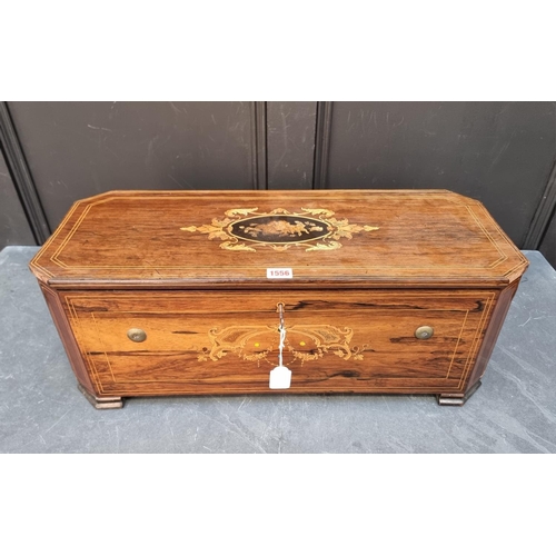 1556 - A late 19th century Swiss rosewood and inlaid music box with organ section, with 14in cylinder, play... 