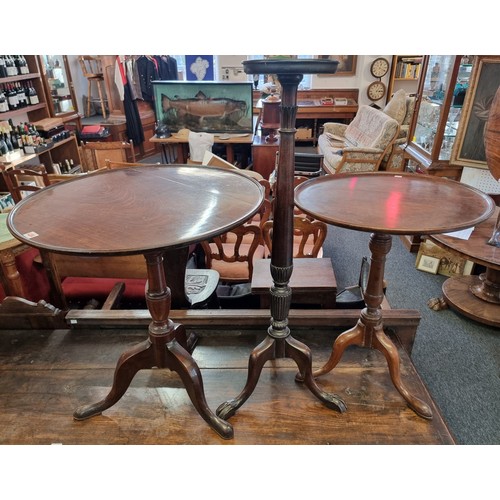 1071 - Two 19th century mahogany circular tilt top tripod tables, each with dished top, 66.5cm and 56cm dia... 