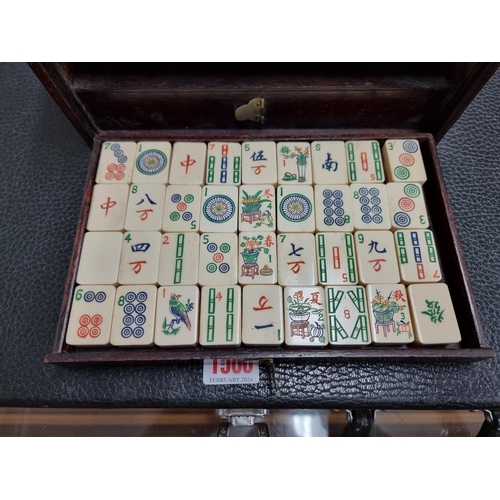 1303 - A cased bone and bamboo Mahjong set.