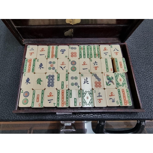 1303 - A cased bone and bamboo Mahjong set.