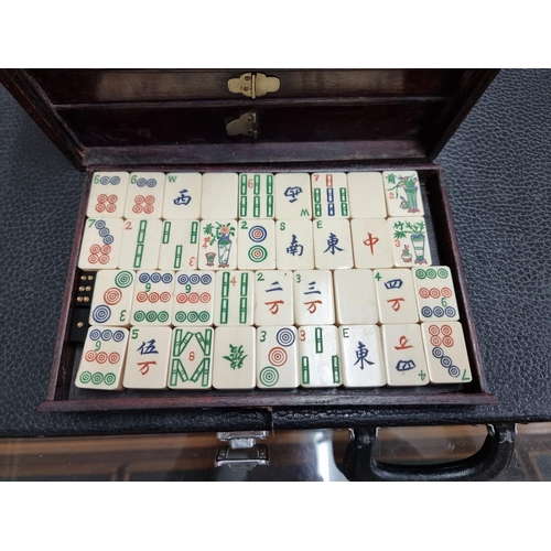 1303 - A cased bone and bamboo Mahjong set.