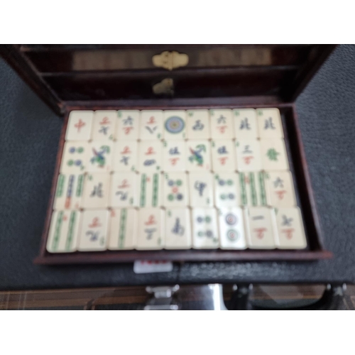 1303 - A cased bone and bamboo Mahjong set.