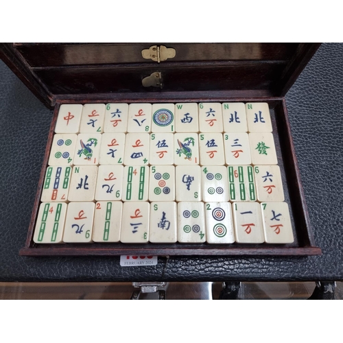 1303 - A cased bone and bamboo Mahjong set.