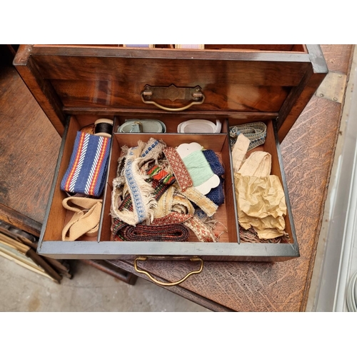 1196 - A late Victorian figured walnut work box, 34cm wide.