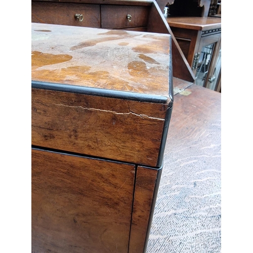 1196 - A late Victorian figured walnut work box, 34cm wide.