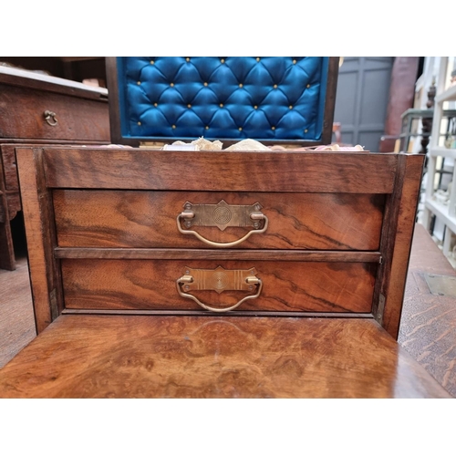 1196 - A late Victorian figured walnut work box, 34cm wide.