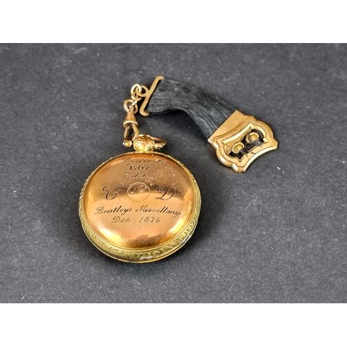 CHARLES DICKENS POCKET WATCH, gifted from Bentleys Miscellany: a William IV gilt metal open faced key wind pocket watch, the fusee movement signed 'William Tyas London, No. 12067, 45mm diameter engine turned dial, the case engraved to reverse 'Dearest Boz editor Bentleys Miscellany Dec.1836', the initials CD to left and right of centre.