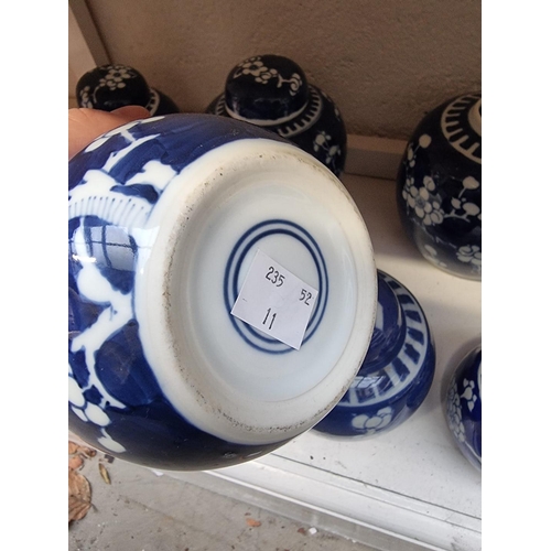 1351 - Nine Chinese blue and white ginger jars and five covers, largest 15cm high. (9)... 