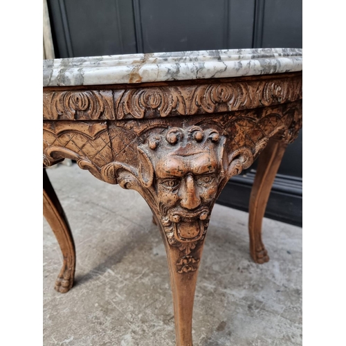 1229 - An interesting 19th century Italian carved walnut and marble top circular occasional table, with sha... 