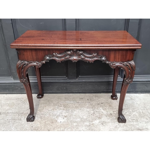 1235 - A good 19th century carved mahogany concertina action tea table, probably Irish, 91cm wide....