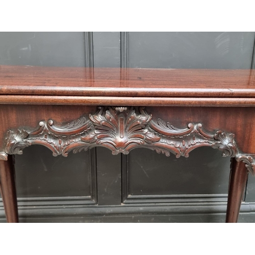 1235 - A good 19th century carved mahogany concertina action tea table, probably Irish, 91cm wide.... 