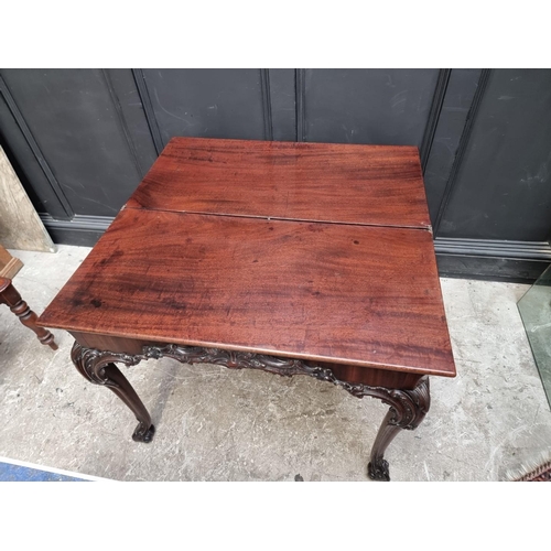 1235 - A good 19th century carved mahogany concertina action tea table, probably Irish, 91cm wide.... 