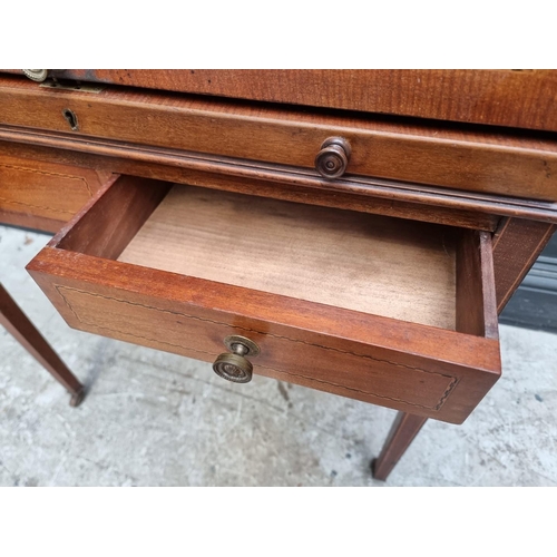 1242 - A small circa 1900 mahogany and line inlaid cylinder bureau, 75.5cm wide.