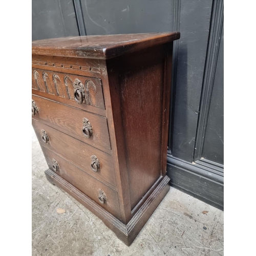 1244 - A small reproduction oak chest, 57.5cm wide.