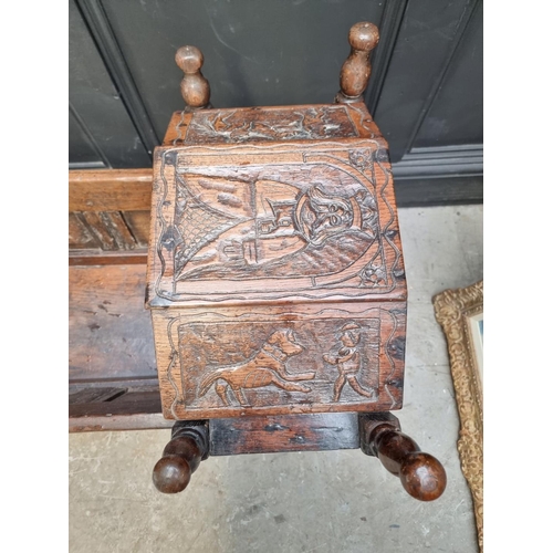 1247 - An antique carved oak panelled child's crib, on rocker base, 92.5cm wide.