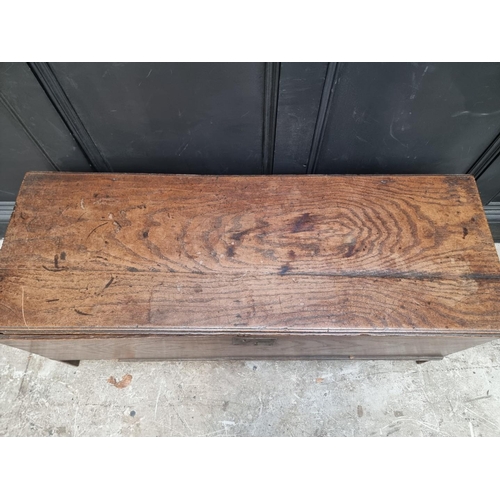 1256 - A late 17th century oak boarded coffer, 114cm wide.