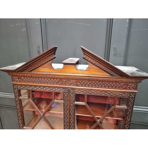 1257 - A good 19th century mahogany blindfret display cabinet, in the Chippendale style, 76.5cm wide.... 