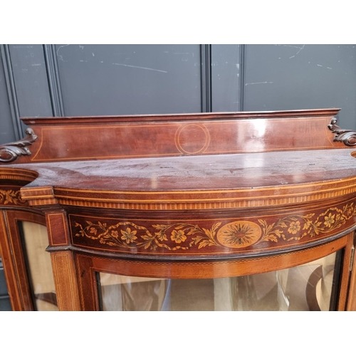 1258 - A circa 1900 mahogany and inlaid serpentine fronted display cabinet, 119.5cm wide.... 