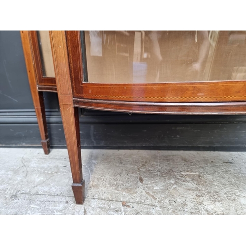 1258 - A circa 1900 mahogany and inlaid serpentine fronted display cabinet, 119.5cm wide.... 