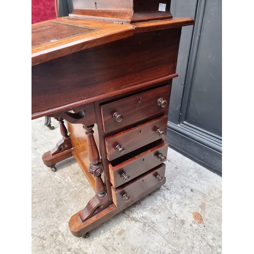 1262 - A Victorian walnut and satinwood crossbanded Davenport, 54cm wide.