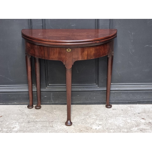 1273 - An 18th century 'red walnut' double fold-over card table, with single gateleg, 84cm wide.... 