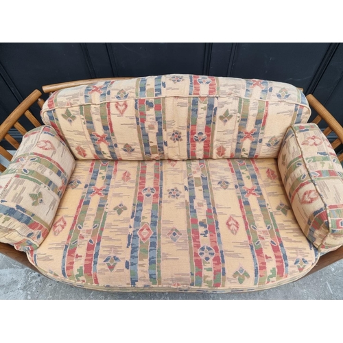 1277 - An Ercol two seater settee and matching armchair.