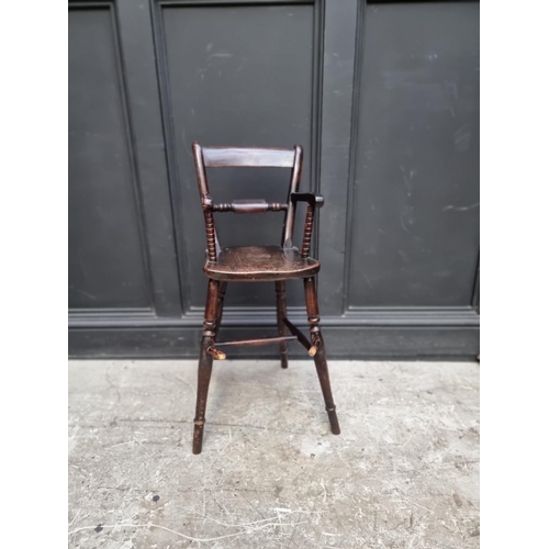 1280 - An antique stained beech child's highchair.