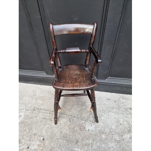 1280 - An antique stained beech child's highchair.