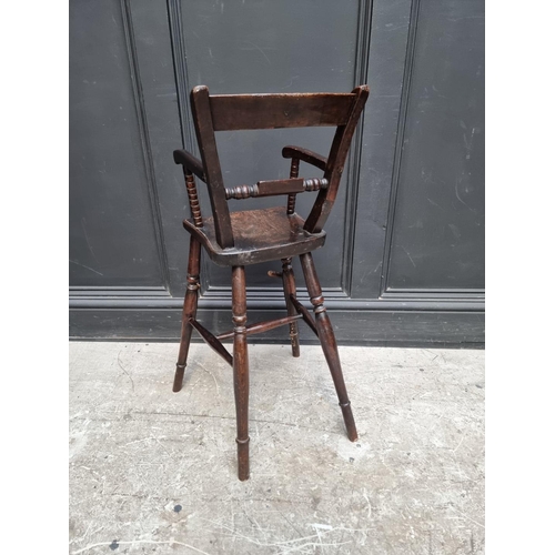 1280 - An antique stained beech child's highchair.