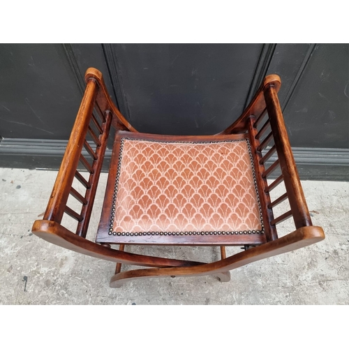 1281 - A circa 1900 beech and upholstered folding 'X' frame stool, 51cm wide.