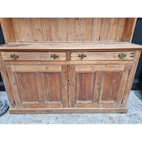 1289 - An antique pine dresser and rack, 170.5cm wide.