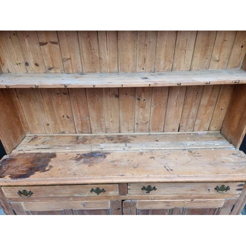 1289 - An antique pine dresser and rack, 170.5cm wide.