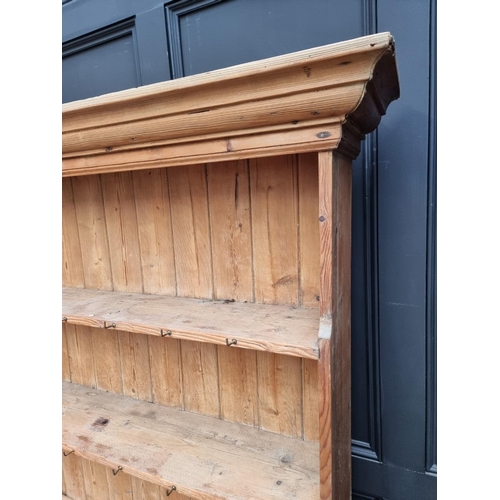 1289 - An antique pine dresser and rack, 170.5cm wide.