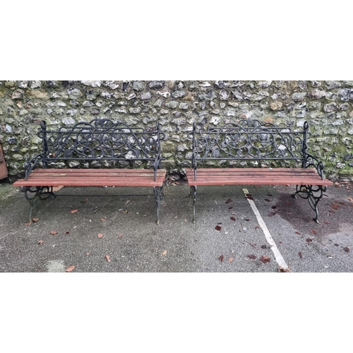 1291 - A pair of steel or cast iron garden benches, total width 122cm. (2)